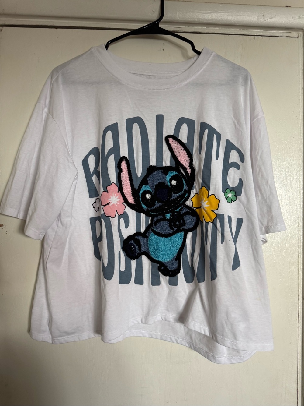 White Stitch Graphic Tee with Floral Accents